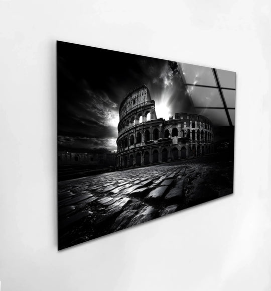 Reflecting art from glass, the monochromatic Roman Colosseum wall art's cobblestone road displays a rough surface texture, complementing the ancient architectural design.