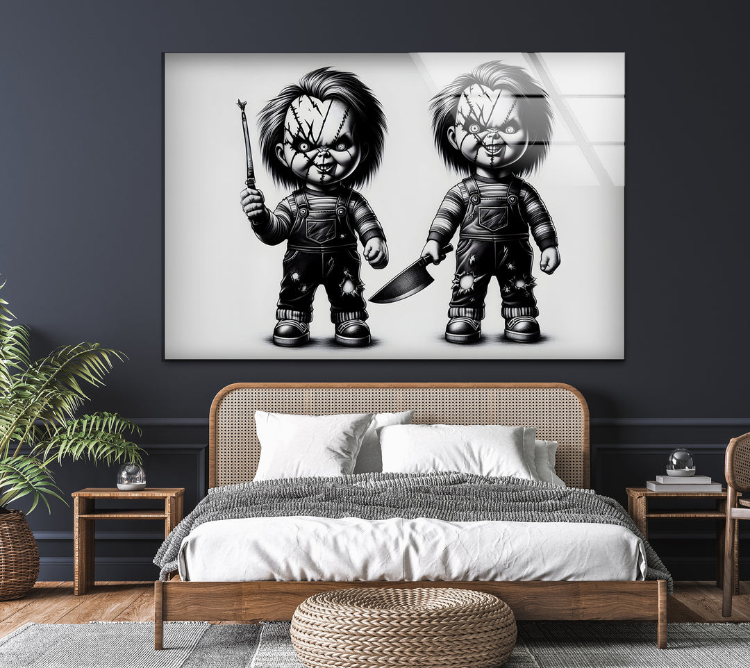 A striking black and white artwork depicting two sinister dolls ready to unleash terror.


