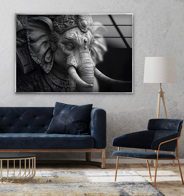 Elegant monochrome glass wall art featuring the detailed statue of Lord Ganesha.
