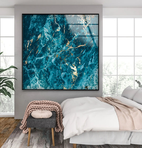 Turquoise and gold marble-effect glass wall art prints with a smooth, reflective finish.