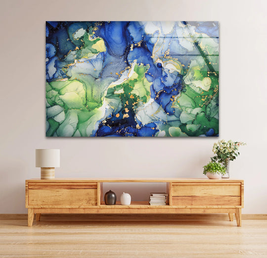 A bright, swirling expanse of emerald green and sapphire blue gold-flecked glass art painting dominates the scene.