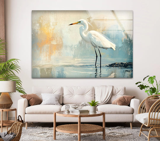 A serene white egret stands still in tranquil waters, creating a peaceful moment in this glass wall art home decor.