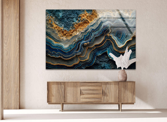 A luxurious blue and gold abstract hanging wall art showcases a rich, textured surface with intricate marbled layers and golden veining.