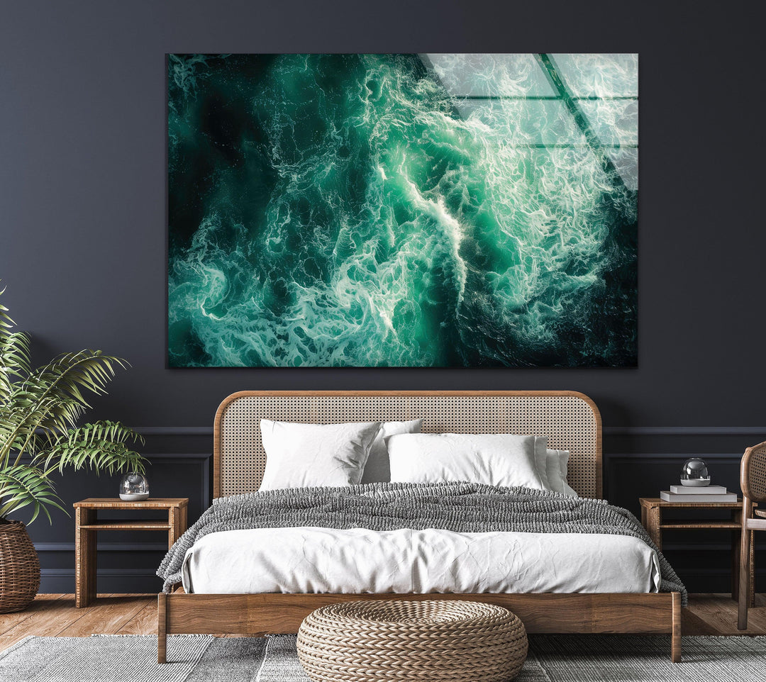 Glass wall art with foaming sea waves in a breathtaking aerial view.
