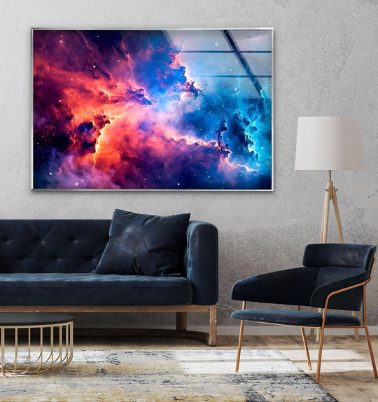Cosmic nebula wall prints in vibrant blues and fiery oranges on a textured concrete wall.
