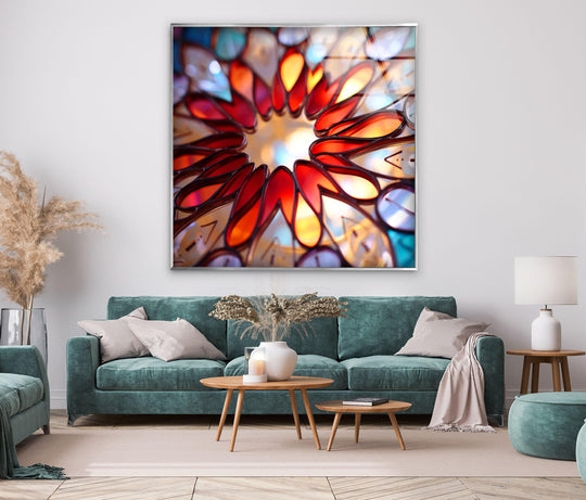 Vibrant stained floral window glass wall artwork emanates intense reds and oranges, commanding attention with its bold, kaleidoscopic design.