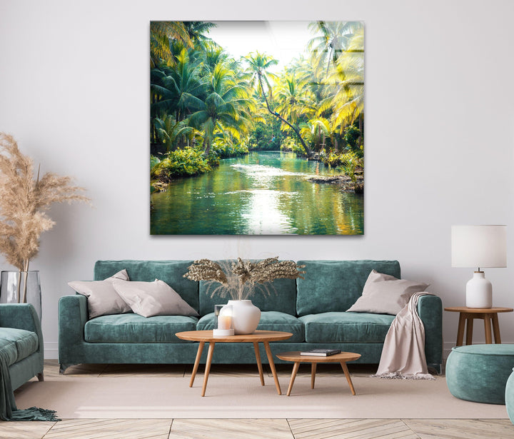 Lush paradise river surrounded by towering palm trees and rich greenery.
