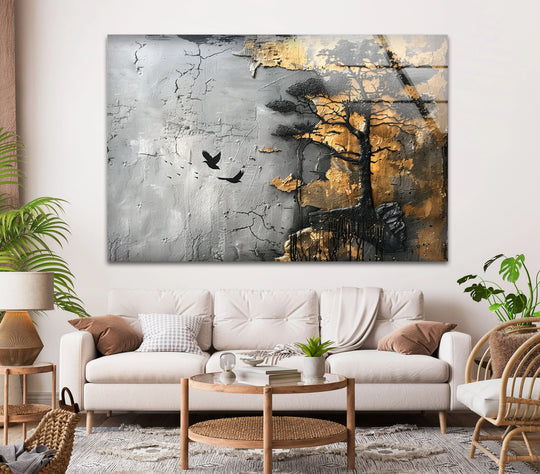 A stark black tree and dark abstract shapes are set against a textured gray and gold background in this captivating print wall art.