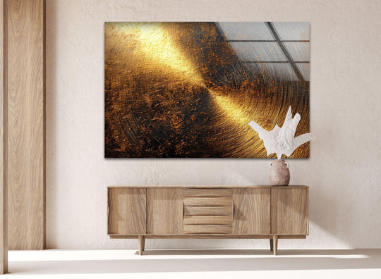 Abstract glass wall artwork captures a dramatic transition from deep black to luminous golden hues with subtle linear textures.