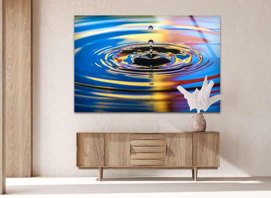 Horizontal rectangle tempered glass wall art showcases a striking abstract rippling water reflection, creating a visually captivating shape.