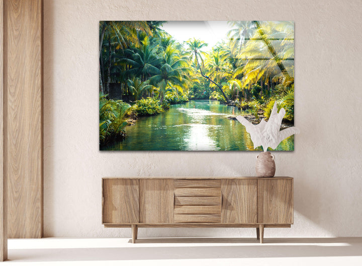 Exotic tropical paradise with a flowing river and vibrant green foliage.
