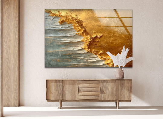Luxurious art from glass captures the opulent, textured finish of golden waves crashing into a serene sea.