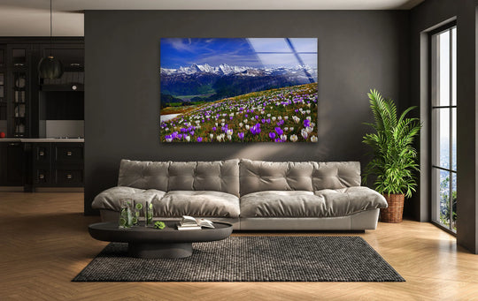 The focal point is a vibrant alpine meadow scene depicted as tempered glass wall art, showcasing a majestic mountain landscape with blooming wildflowers.