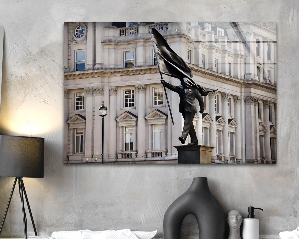 Elegant historic architecture with classical columns and intricate window details forms the background, enhancing the unique modern wall decor.