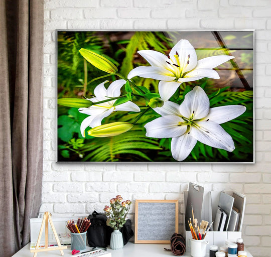 Aspirational and peaceful, the white lily flowers glass hanging wall art adds a botanical touch to the bright and tidy artist's workspace.