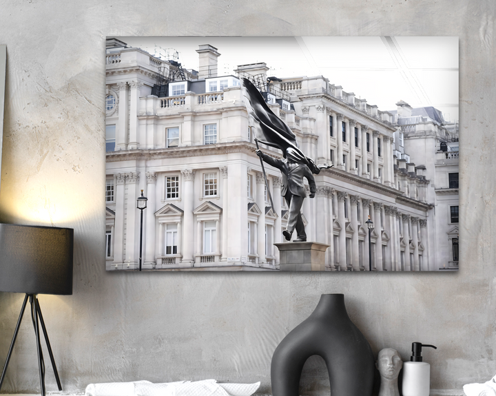 The realistic detail of a striking Banksy statue, a man with a flag-draped head, beautifully rendered as print wall art, showcasing architectural depth.