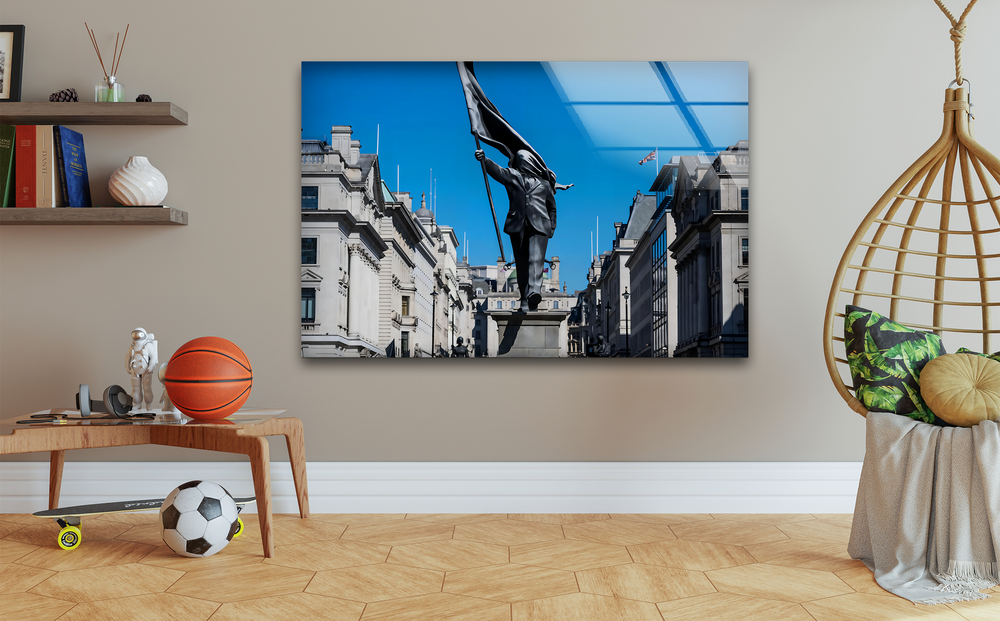 The stillness of an urban moment, with a flag-holding statue under a vast blue sky, defines this impressive decorative wall art.