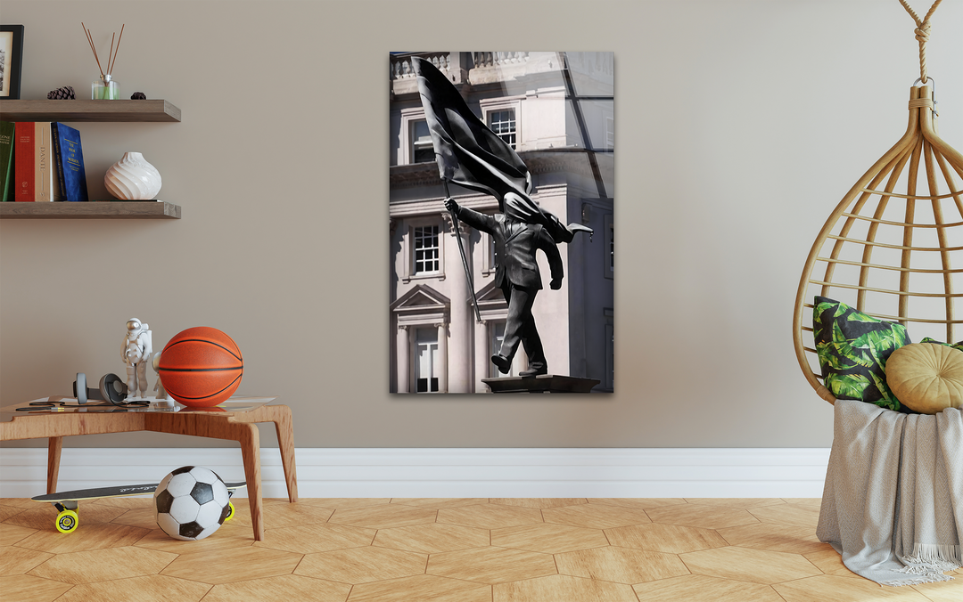Hexagonal flooring, rectangular shelves, and the distinctive Banksy Sculpture art from glass create a visually geometric and modern space.