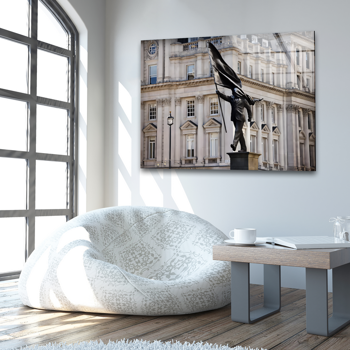 The foreground showcases a comfortable patterned beanbag, a small wooden table holding a white mug and book, enhancing the best glass art piece.