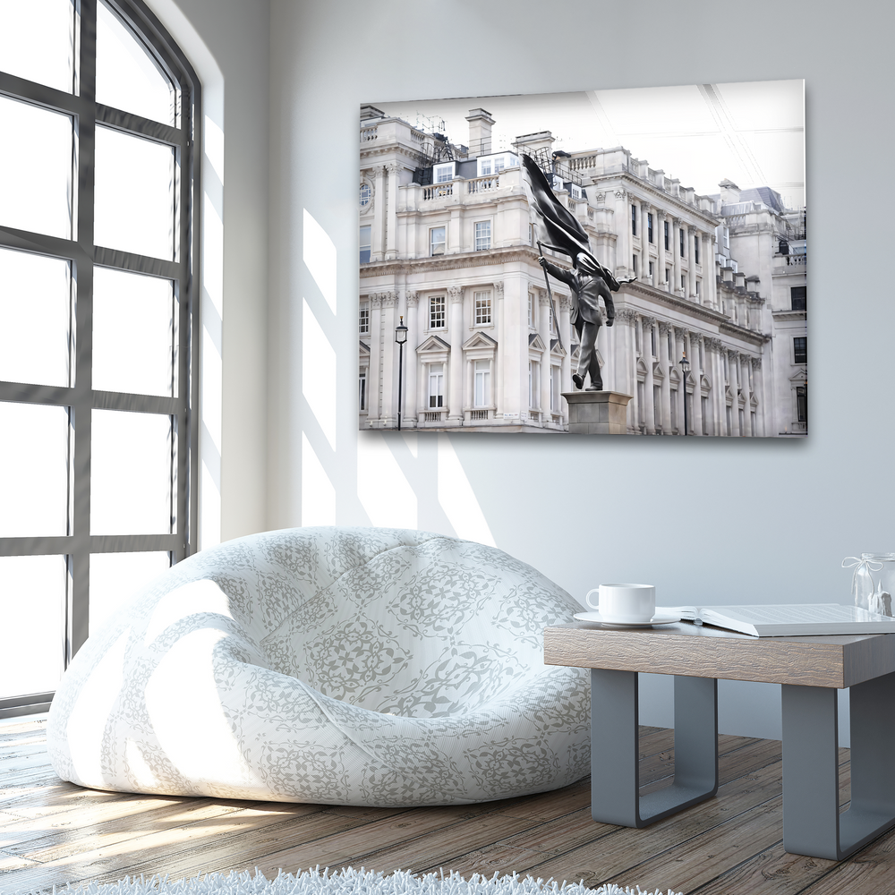 Strong color contrast between the bright room and the monochromatic Banksy statue glass wall art creates unique modern wall decor.