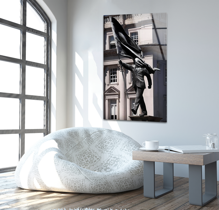 Bright white dominates the room, featuring a striking Banksy Sculpture glass wall art decor piece, adding urban elegance.