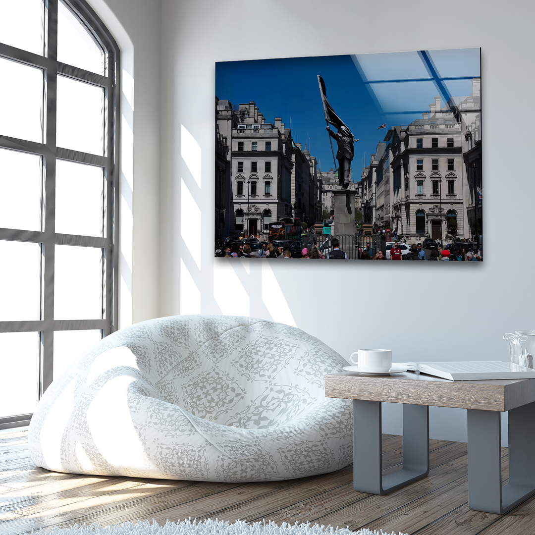 Showcasing rich depth and layers, reflective Banksy London Glass Wall Art depicts a bustling city street with a statue, ideal home decoration.