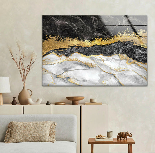 A serene black, white, and gold marble glass wall art piece embodies unique modern wall decor and stillness.