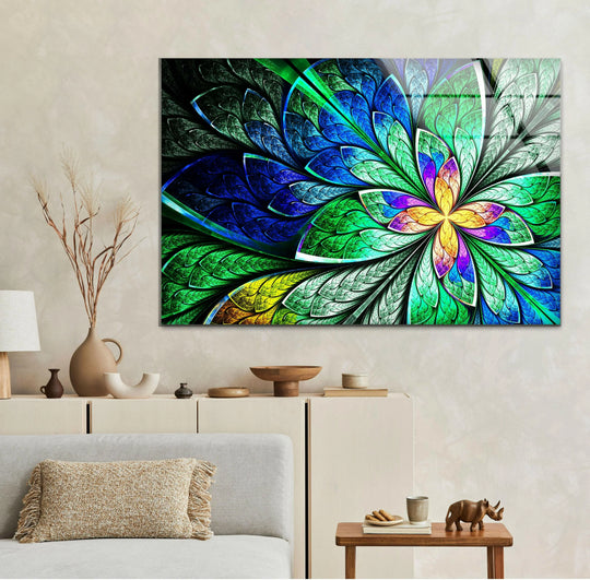 A vibrant fractal flower glass printing artwork is framed by subtle borders on a textured wall.