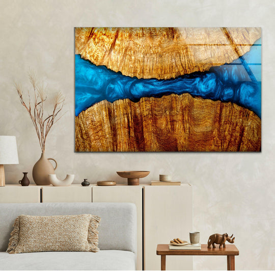Vibrant azure resin flows through warm wood grain in this striking art from glass piece, offering bold color contrast.