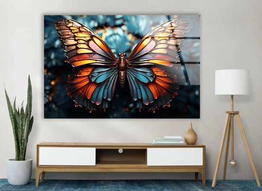 A horizontal, rectangular glass wall art print showcases a metallic butterfly with vibrant, layered wings in exquisite detail.