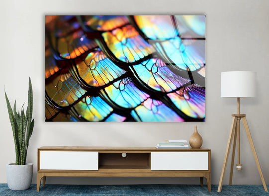 Close-up of iridescent abstract glass art with vibrant blues, yellows, and oranges, creating eye-catching decorative wall art.