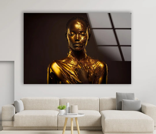 Rich, golden hues dominate this striking glass wall art, showcasing a woman’s portrait with opulent metallic accents.
