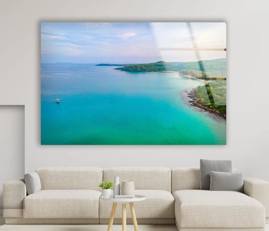Highlighting the abstract quality, the swirling turquoise hues of this tropical land and ocean print wall art create a mesmerizing visual for any space.