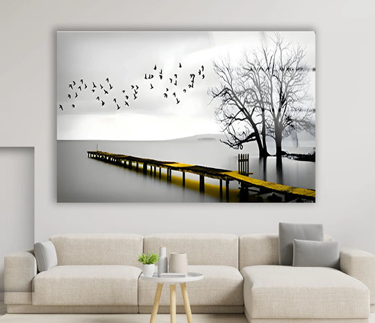 High color contrast emphasizes the monochromatic black and white scene of the Black & White Dock and Birds glass art painting, with a striking yellow dock adding a focal point.