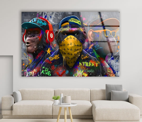 The loudest element of this vibrant wall art prints is the graffiti-covered monkeys in bold streetwear and bright yellow bandana.