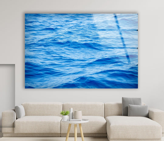 The glistening surface texture of this vivid blue sea waves glass wall art shimmers, creating dynamic wall art prints that capture the ocean's movement.