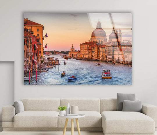 Highly saturated colors bring to life this Venice Canal glass wall art, showcasing a unique modern wall decor piece with boats and the iconic Grand Canal at sunset.