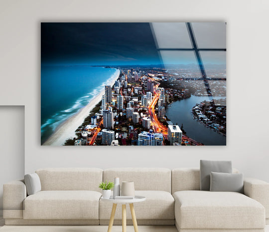 Illuminated Gold Coast skyline showcases a captivating coastal city view at night, a majestic display of art from glass with the brightest building lights.