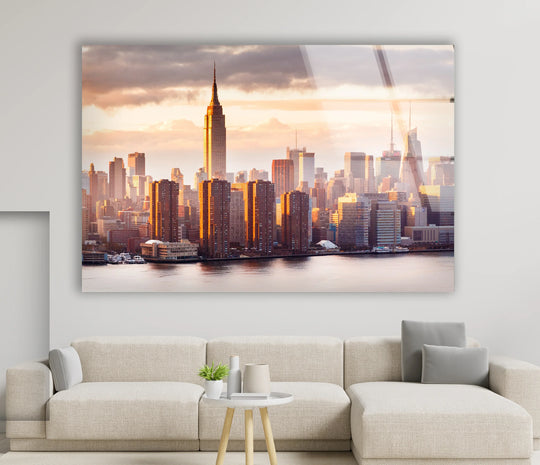 City prints featuring the Empire State Building and the stunning NYC skyline at sunset in a glossy glass wall art bringing majestic New York City charm home on a white wall