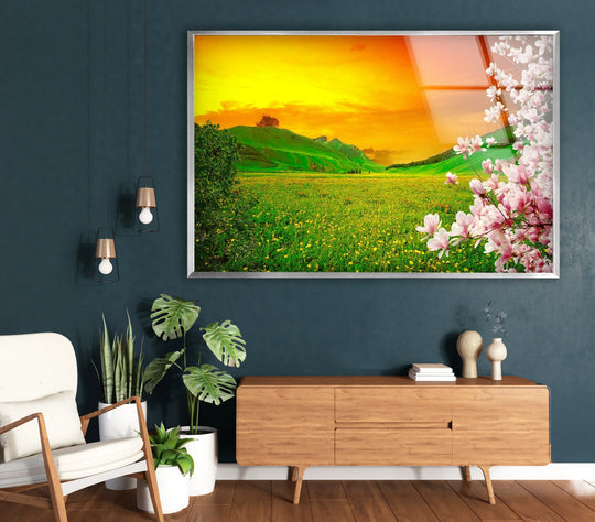 Deep shadows define the wall behind the stunning Sunset Meadow hanging wall art, accentuating its vibrant landscape and blossoming flowers.
