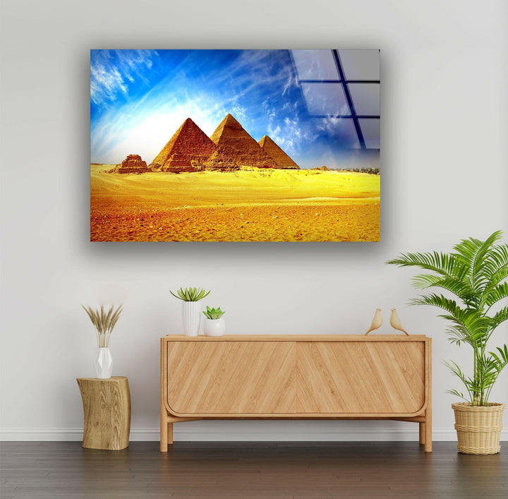 Desert landscape wall art with the towering pyramids bathed in golden sunlight.
