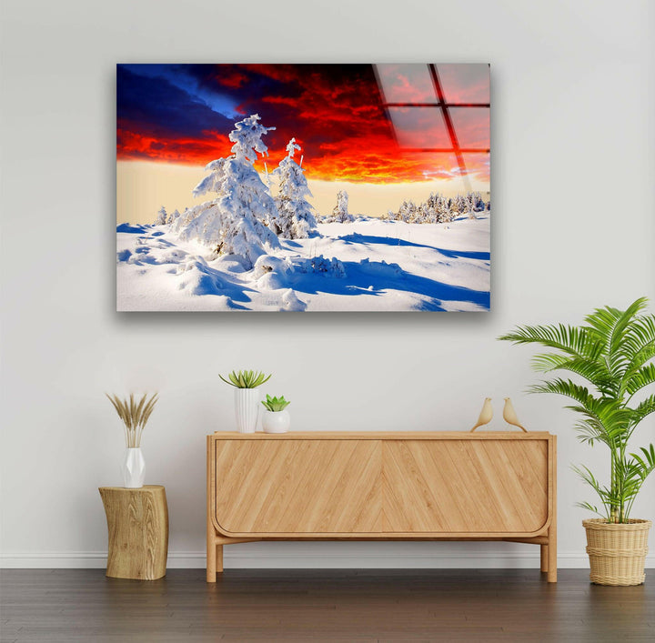 Frozen Serenity: Snow-Covered Landscape Under a Dramatic Sky – A Unique Glass Print
