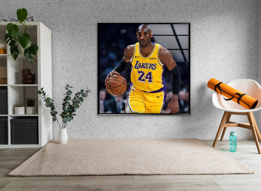 High-energy glass wall art of a basketball player driving forward with focused intensity.