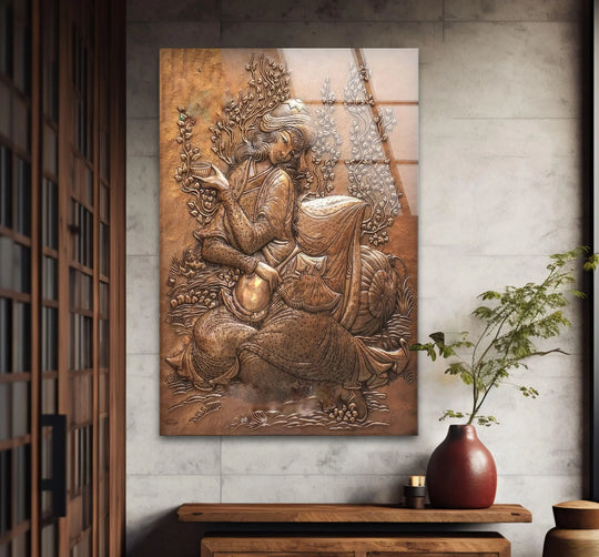 A bronze relief of a woman holding a vessel, featuring a textured, layered background that enhances the dimensional art from glass.