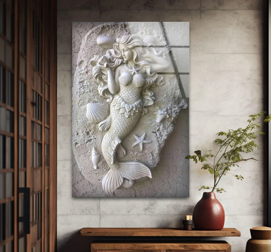 A striking stone mermaid sculpture, rendered in a unique modern wall decor style, commands attention in this striking glass art.