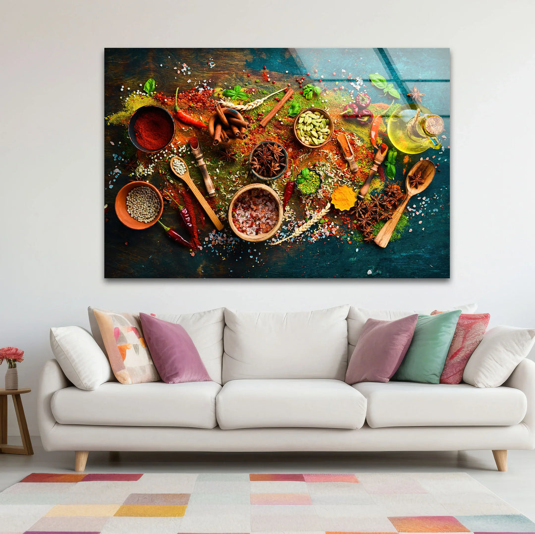 Colorful spices and herbs glass wall art displayed above a cream sofa adds rustic kitchen decor with vibrant reds, greens, and browns in a horizontal format.