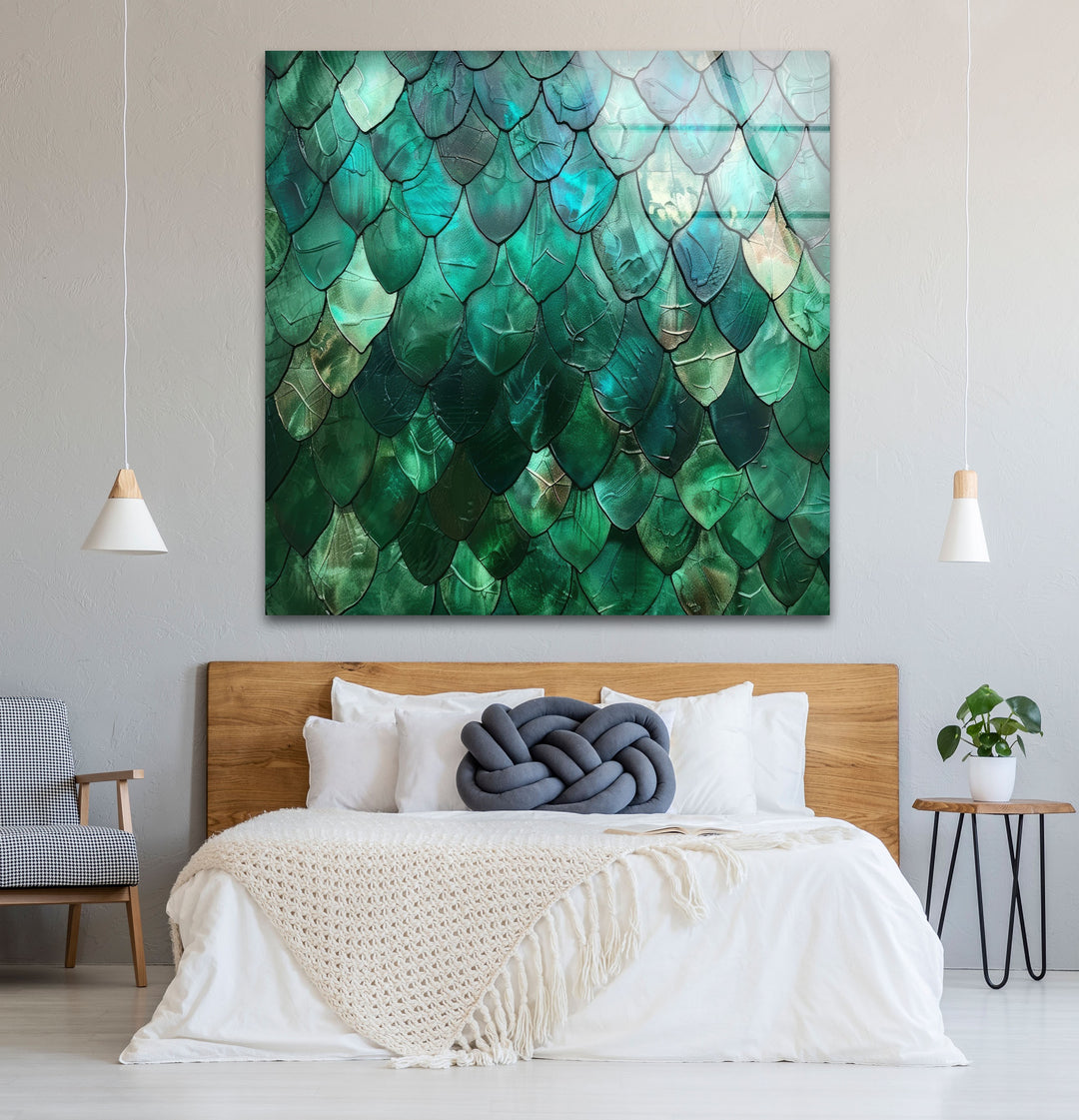 The organic forms of emerald-toned, layered scales create a captivating abstract green glass wall art decor with a fluid texture.