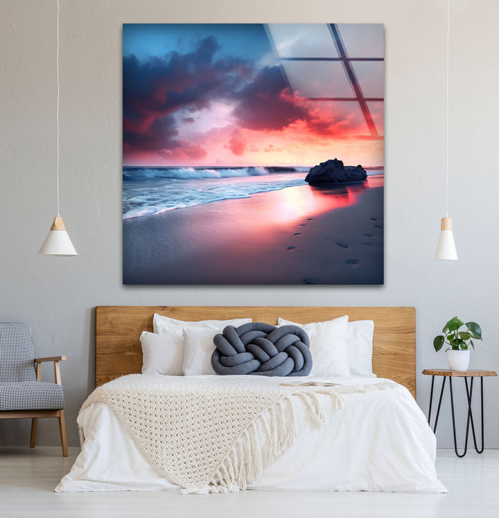 Dramatic Sunset Beach Wall Art – Stormy Sky and Footprints Glass Print for Bold Decor