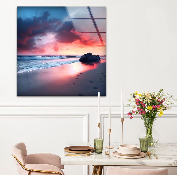 Dramatic Sunset Beach Wall Art – Stormy Sky and Footprints Glass Print for Bold Decor