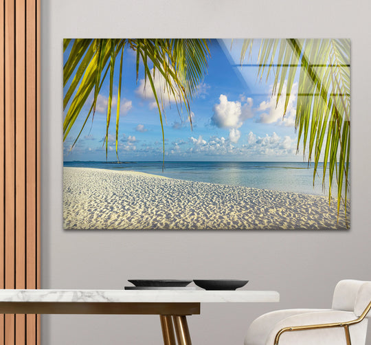 Rich color saturation enhances the tropical palm beach glass print, a stunning home decor piece with white sand meeting the azure ocean.